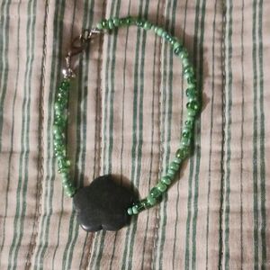 Green Beaded Bracelet with Flower Charm
